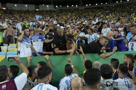 Argentina and Brazil charged by FIFA after fan violence delays World Cup qualifying game at Maracana